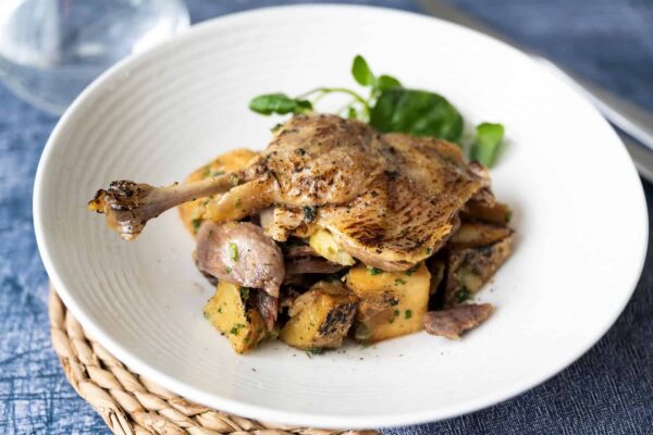 duck leg on a plate