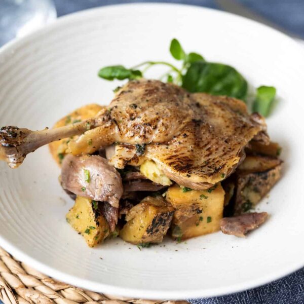 duck leg on a plate
